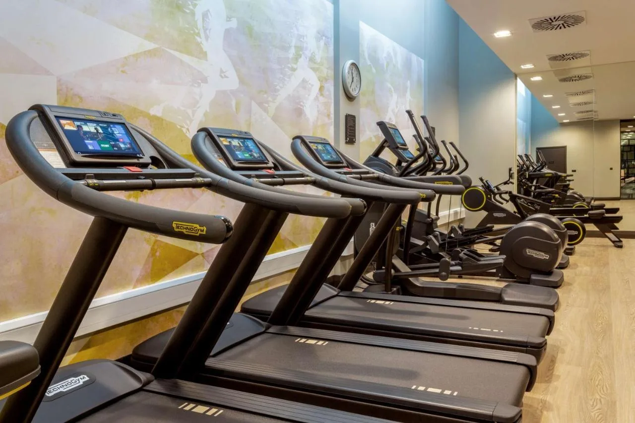 Row of cardio machines in the fitness centre at Hilton Aberdeen TECA